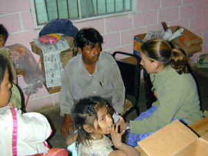 Merideth seeing patients at the Migrant workers camp